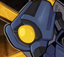 a close up of a blue robot with a yellow eye