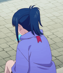 a girl in a ponytail is sitting on a sidewalk