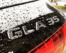 a close up of a black car with the word glass on the back