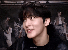 a close up of a young man 's face with the words vvwithkitty below it