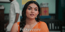 a woman in an orange saree says " fuckyyyyy "