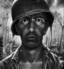 a black and white photo of a soldier wearing a helmet and looking at the camera .