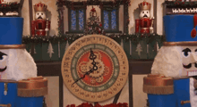 a nutcracker stands next to a clock that shows the month of july on it