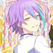 a boy with purple hair and blue streaks is smiling in a room .