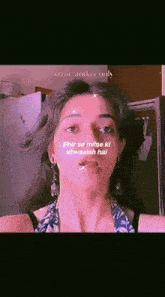 a close up of a woman 's face with a pink background and a quote on it .