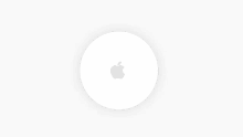 a white circle with an apple logo on it .