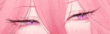 a close up of a girl 's eyes with pink hair .