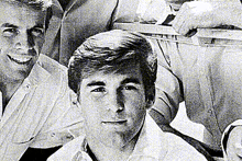 a black and white photo of a group of young men posing for a picture