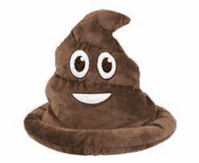 it looks like a poop hat with a smiling face on it .