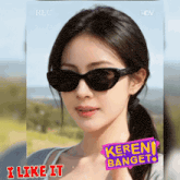 a woman wearing sunglasses has a sticker that says " keren banget "