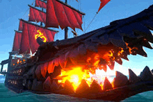 a large pirate ship with red sails is floating in the ocean .