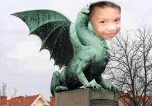 a statue of a dragon with a child 's face on top of it .