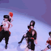 a group of women are dancing in front of a sign that says cho