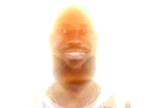 a blurry picture of a man 's face with a white background