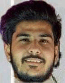 a close up of a man 's face with a beard and purple hair .