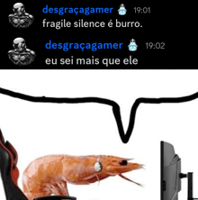a shrimp wearing headphones is sitting in front of a computer