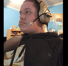 a man wearing a headset that says logitech