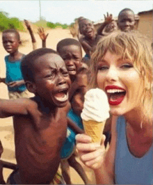 a woman is holding an ice cream cone in front of children .