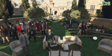 a large group of people are gathered in front of a mansion in a video game called grand theft auto 5