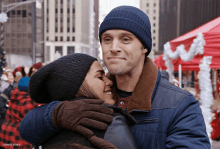 a man and a woman hugging each other with dawnsygifs written in the corner