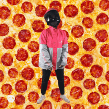 a person standing in front of a pepperoni pizza covered in pepperoni