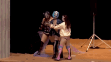 a woman in a blue mask is kneeling down on the floor