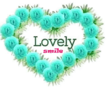 a heart shaped wreath of blue roses with the words `` lovely smile '' written on it .