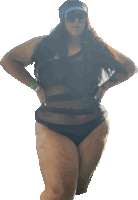 a woman in a black swimsuit and sunglasses is standing with her hands on her hips