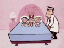 a man in a lab coat is pushing a bed with three dolls on it .