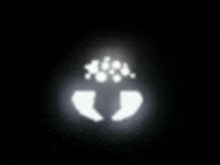 a white silhouette of a person 's footprints in the dark .