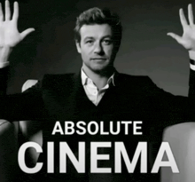 a black and white photo of a man with his arms outstretched and the words absolute cinema above him