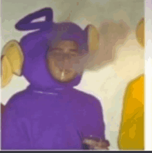 a person dressed as a purple teletubbies character is smoking a cigarette .