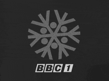 a logo for bbc 1 shows a snowflake with people in it