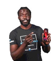 a man wearing a shirt that says ration health holds up a cell phone