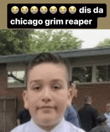 a young boy is standing in front of a building with a caption that says dis da chicago grim reaper