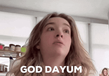 a woman says god dayum while looking up at the camera