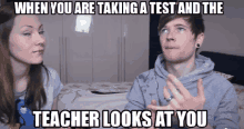 a man and a woman are standing next to each other with a caption that says when you are taking a test