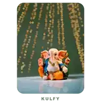 a picture of a statue of ganesha with the word kulfy below it