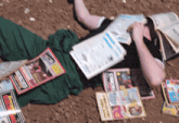 a man laying on the ground reading a book called ' a man 's life '