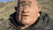 a close up of a man 's face with the words " no " on it