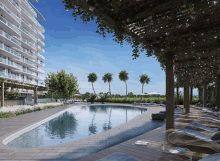 an artist 's impression of a large swimming pool surrounded by chairs and palm trees