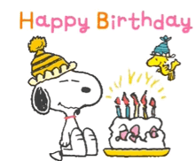 snoopy is blowing out candles on a birthday cake