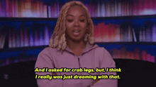 a woman in a purple hoodie says and i asked for crab legs but