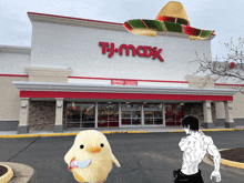 a man in a sombrero stands in front of a t.j.maxx store