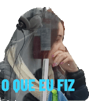 a woman wearing headphones and a scarf with the words " o que eu fiz " written below her