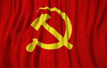 a close up of a red flag with a hammer and sickle on it .