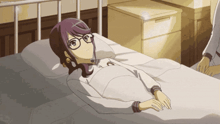 a girl is laying in a hospital bed with glasses on