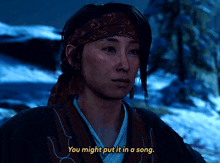 a woman with a bandana on her head says " you might put it in a song "