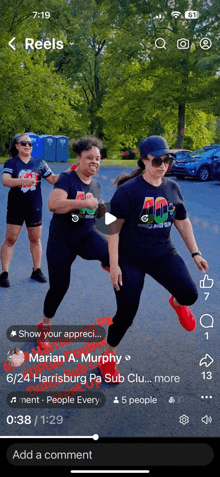 a phone screen shows a video of three women doing exercises with the caption show your appreciation