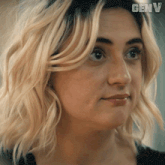 a close up of a woman 's face with the word genv on the bottom right